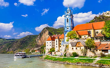 The small town of Durnstein, as seen from the Danube river in Austria